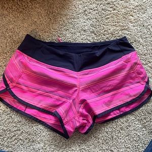 Bright pink Lululemon Run Speed shorts